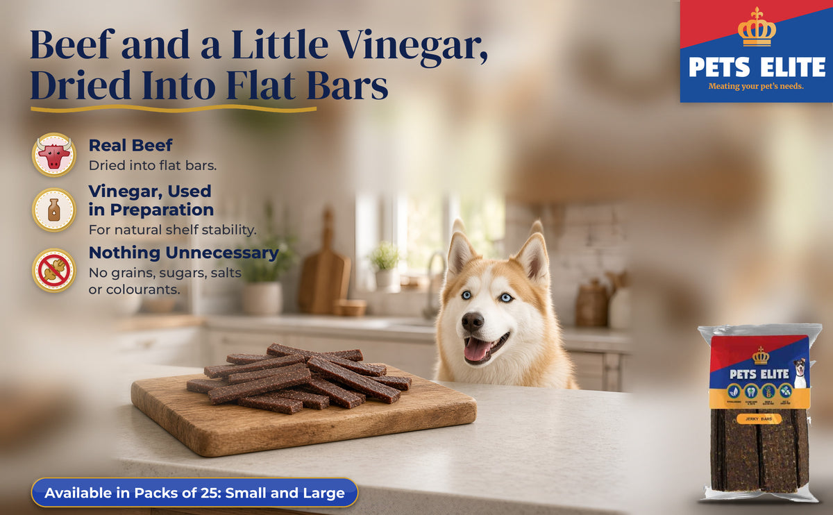 Goberian at a weekend-house kitchen island with Jerky Bars on a wooden board
