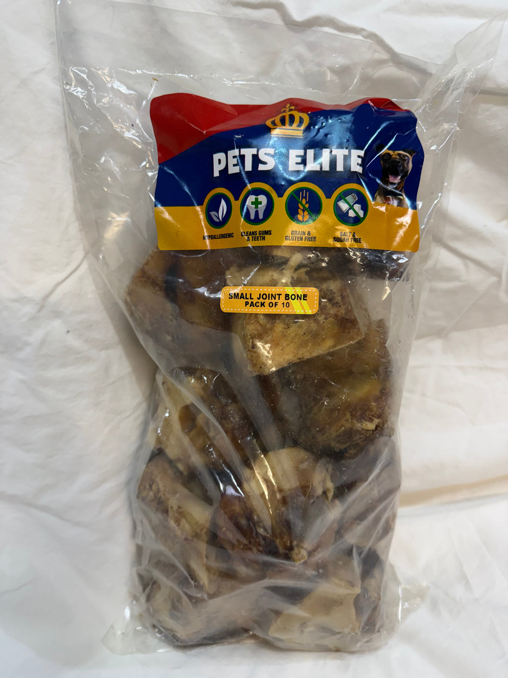 Pets Elite Beef Joint Bone Pack of 10, pack photographed in hand (view 1 of 3) — natural beef joint bone dog chew from Snout & Swagger