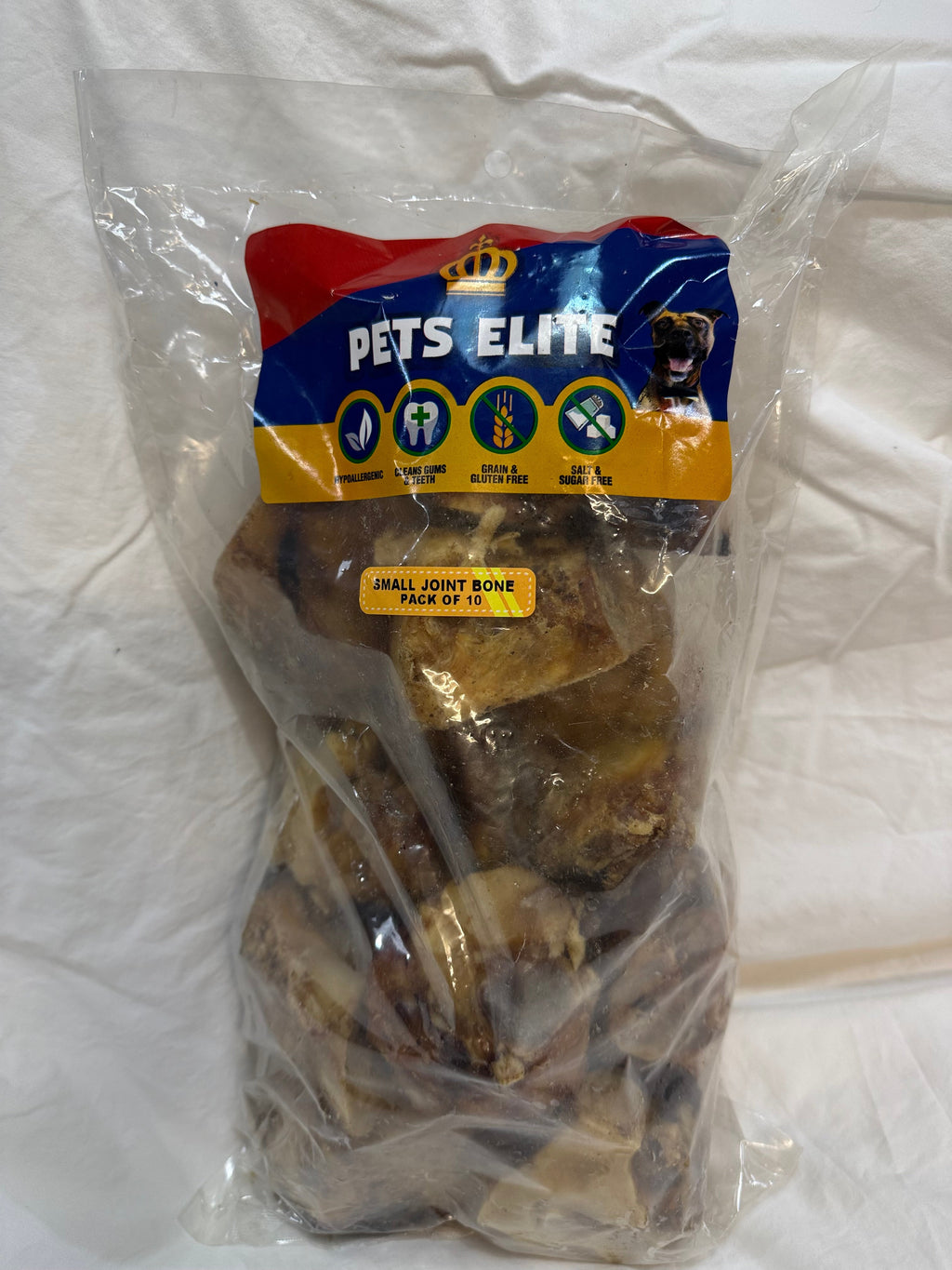 Pets Elite Beef Joint Bone Pack of 10, pack photographed in hand (view 2 of 3) — natural beef joint bone dog chew from Snout & Swagger