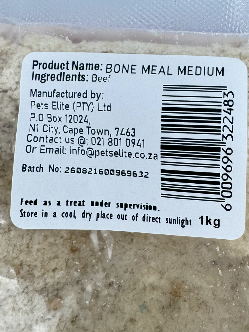 Pets Elite Bone Meal Medium 1 kg, back label showing ingredients and batch number — beef bone meal supplement for dogs